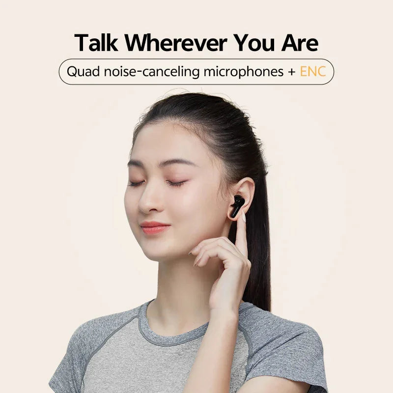 Woman wearing QCY T13 white true wireless earbuds, demonstrating comfortable fit and ENC noise‑canceling microphones