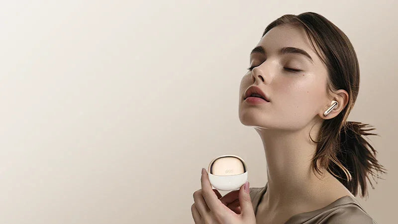 Woman enjoying wireless earbuds with sleek charging case, immersive audio experience