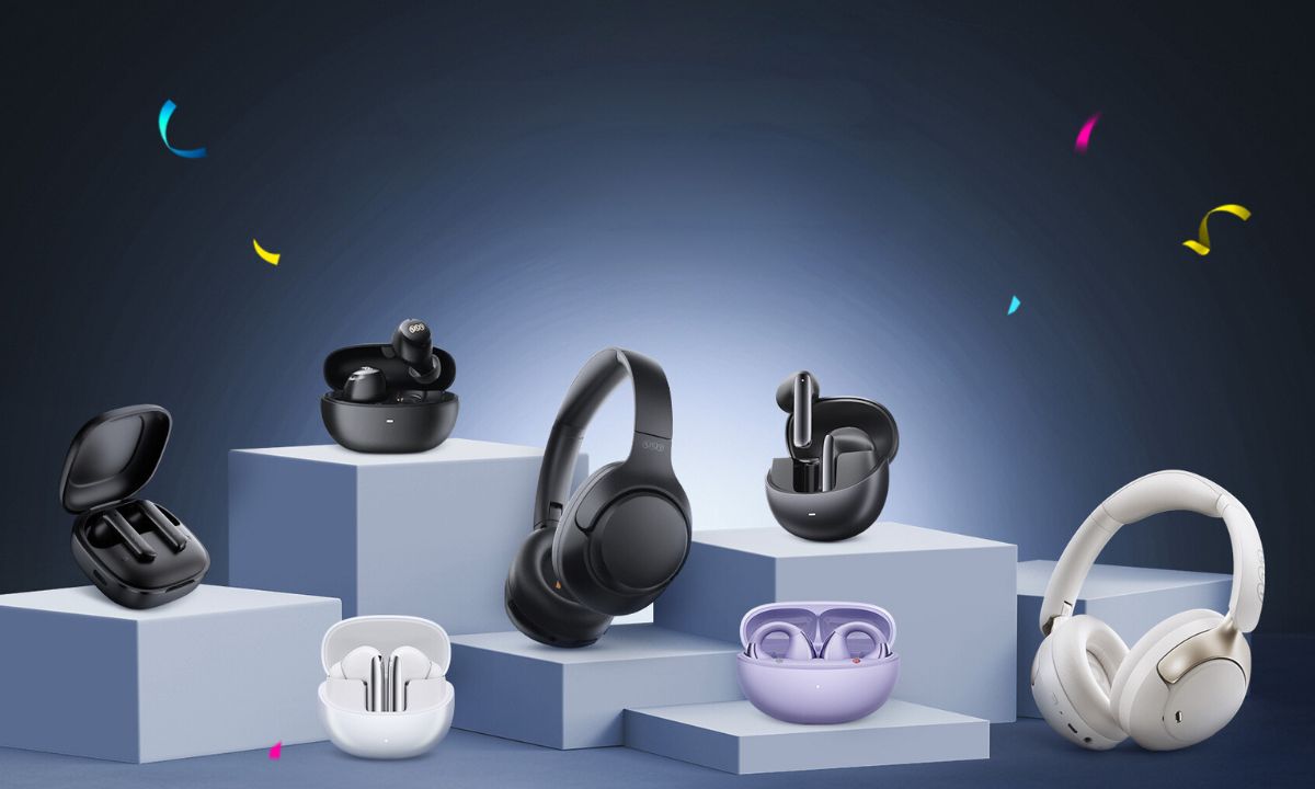 Wireless earbuds and Bluetooth headphones in black, white, and purple on display pedestals with colorful confetti
