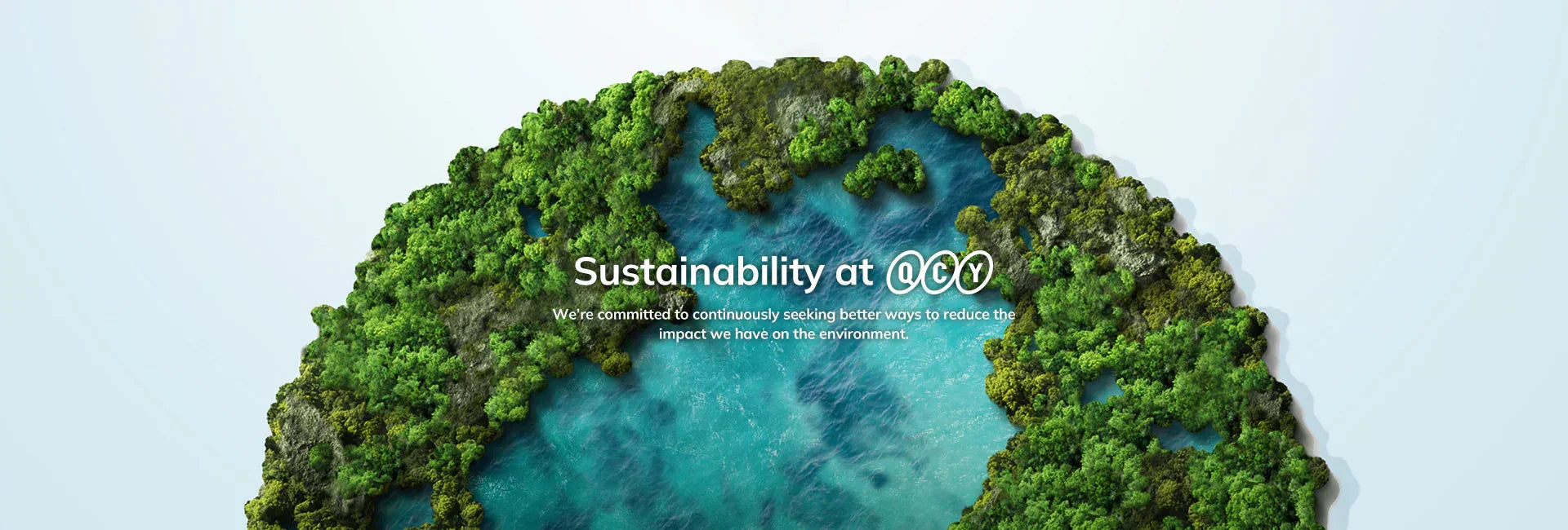 Sustainability at QCY: lush green island with blue waters, showcasing eco-friendly commitment