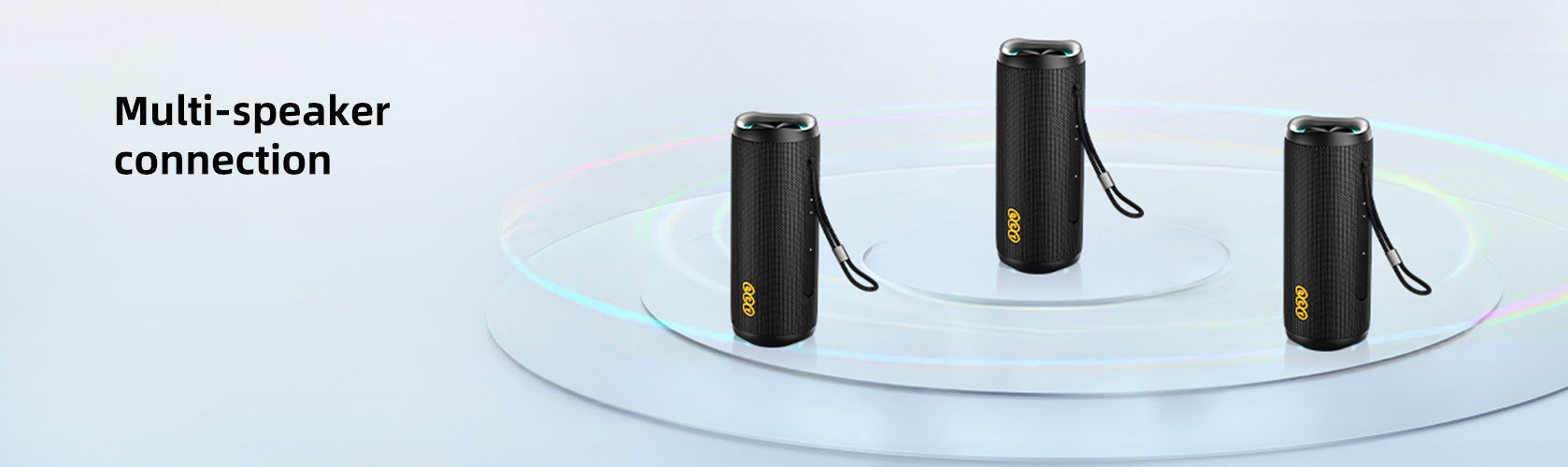 Three black portable Bluetooth speakers with multi-speaker connection feature