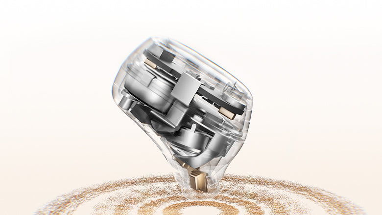 Transparent robotic vacuum cleaner with internal components visible, cleaning dust on white background.