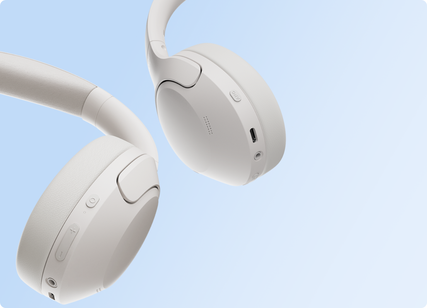 White wireless over-ear headphones with sleek design, USB-C port, and soft ear cushions for comfortable listening.