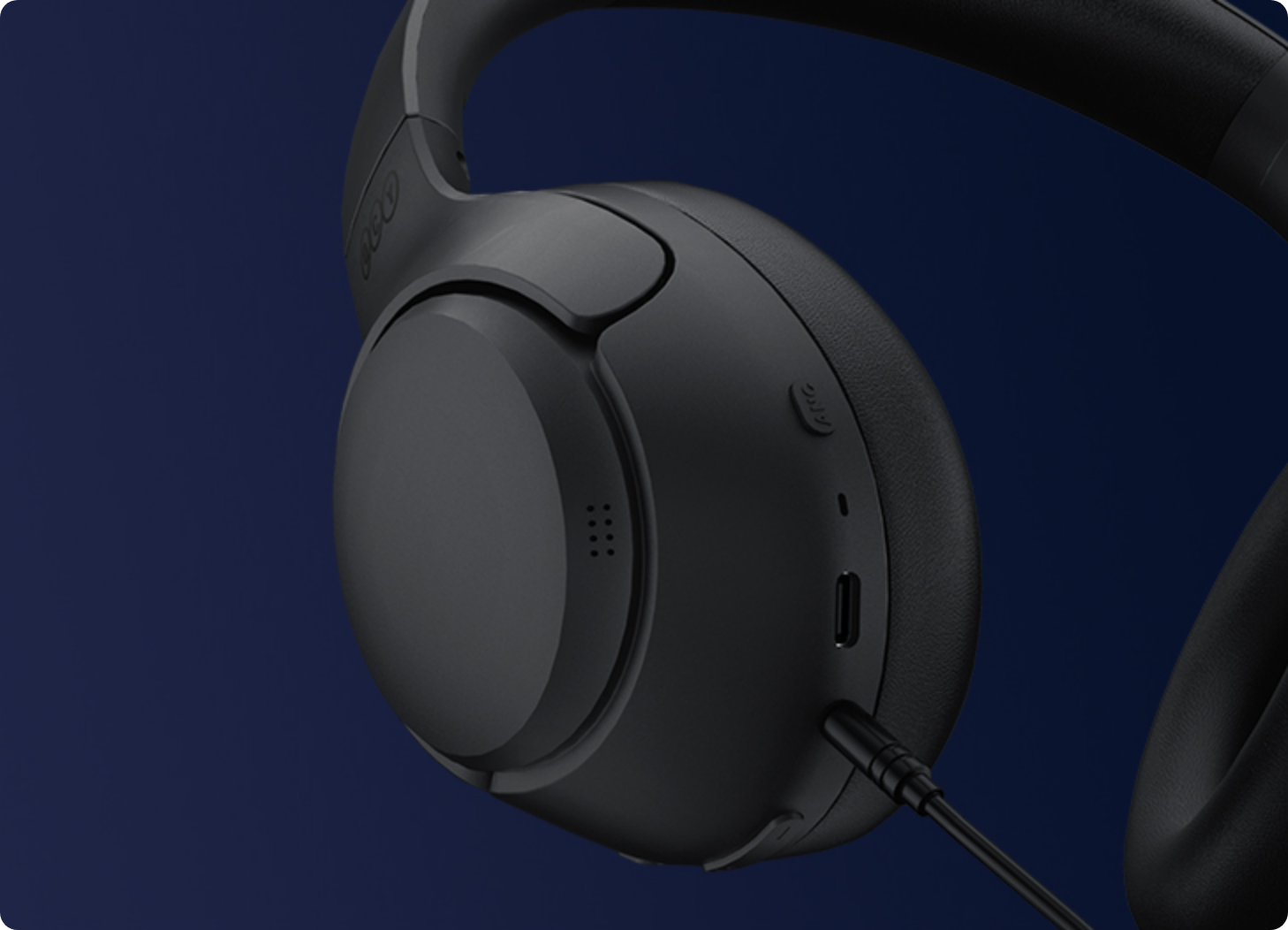 Black over-ear headphones with USB-C port and wired connection, featuring sleek design and premium build quality.