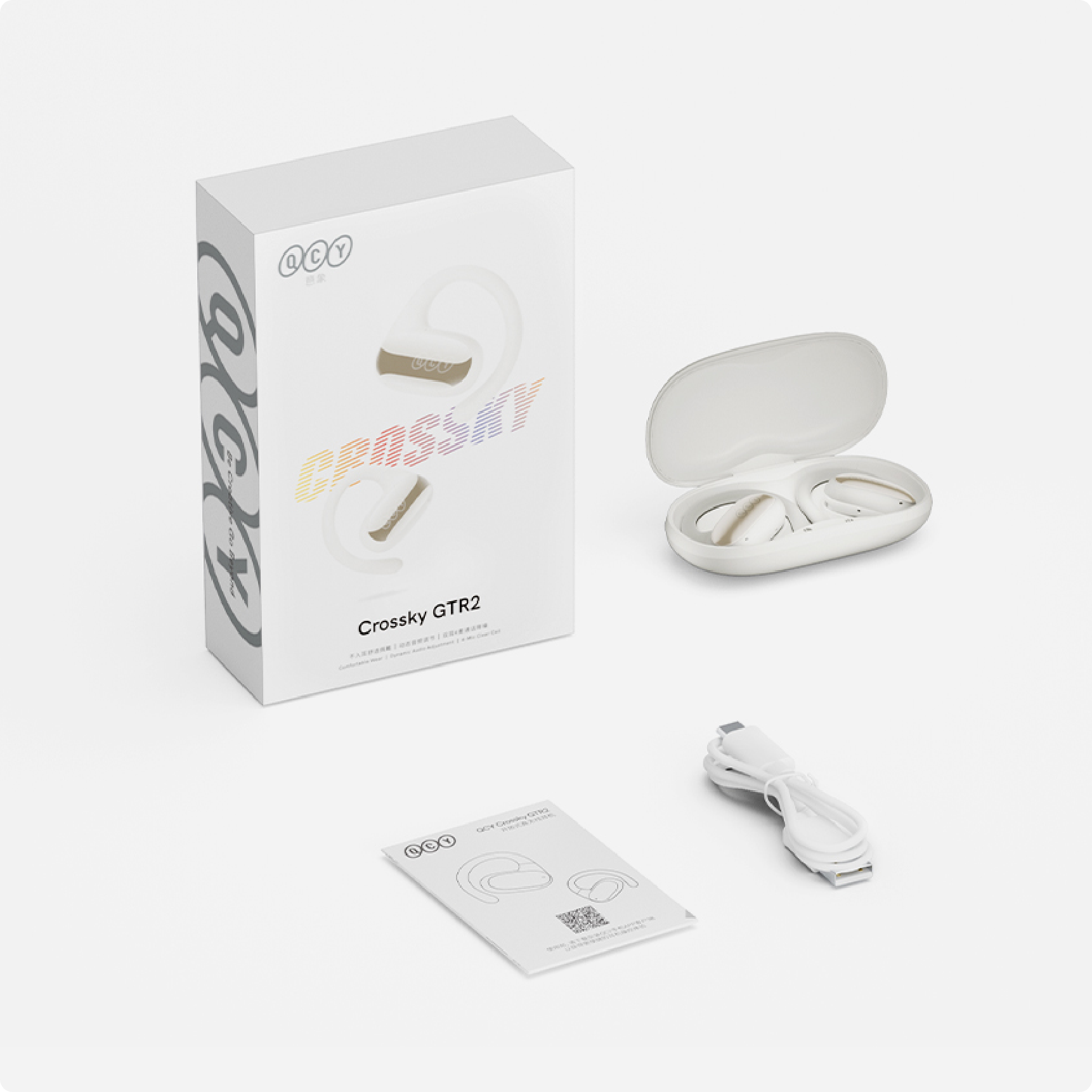 QCY Crossky GTR2 wireless earbuds in white charging case with USB cable and manual.