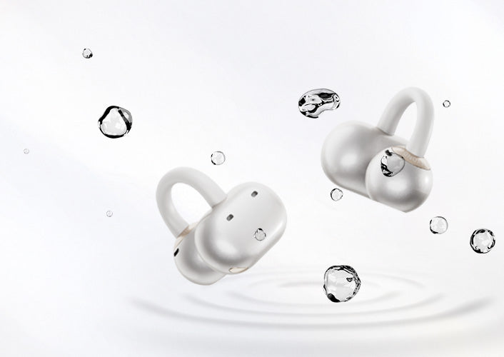 White wireless earbuds with water droplets, IPX7 waterproof design for sports and swimming.